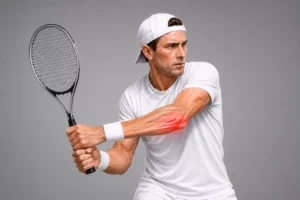 Tennis player experiencing ulnar-sided wrist pain caused by extensor carpi ulnaris (ECU) tendon subluxation during play.
